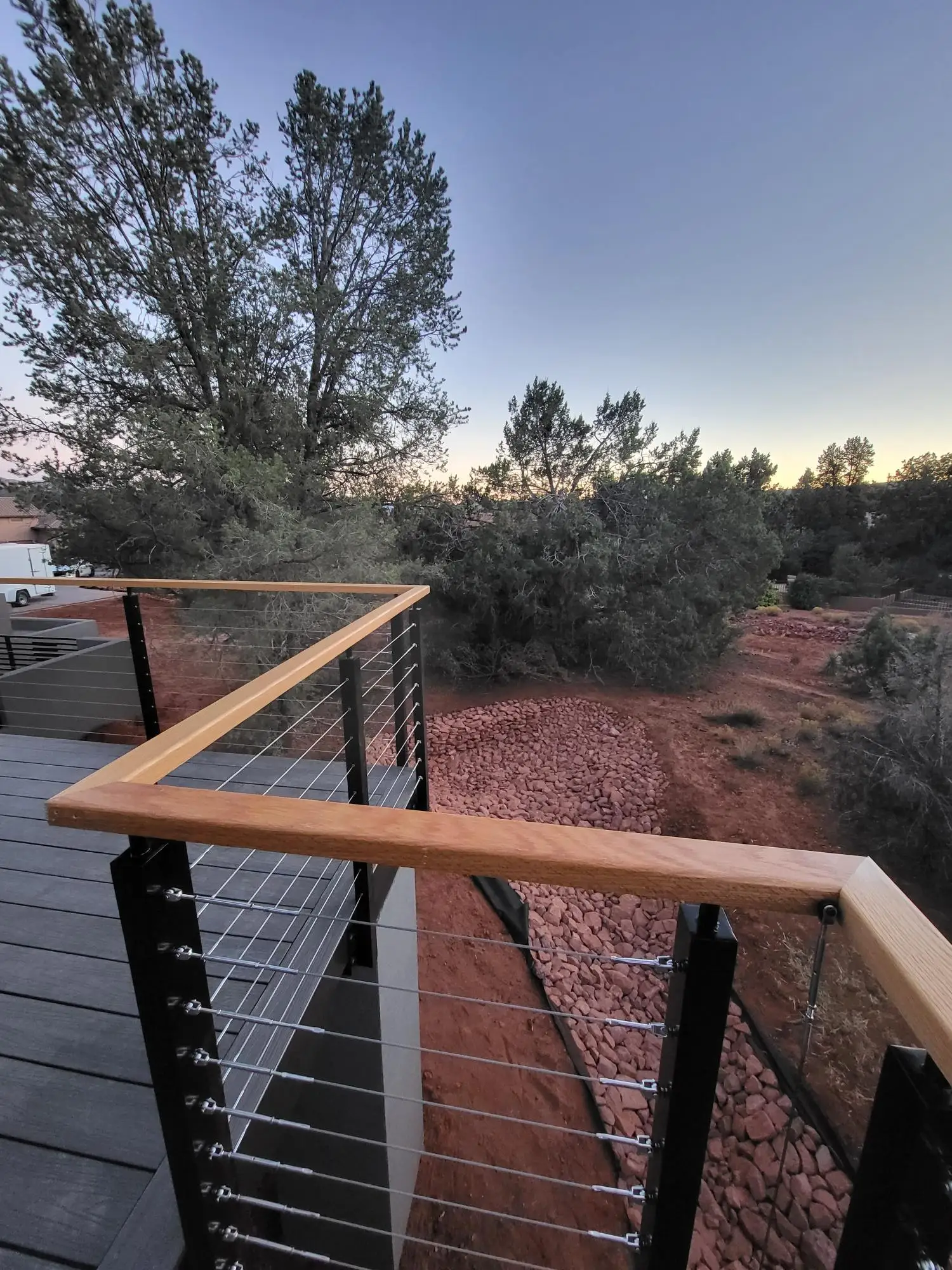 Black aluminum cable railing post with wooden handrail cable railing design