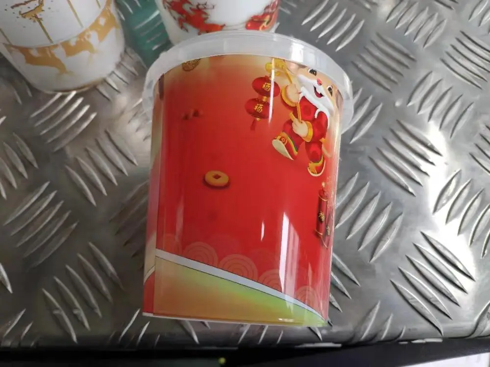 High Speed In Mould Labeling System (IML)Solutions for the packaging industry through effective IML automation