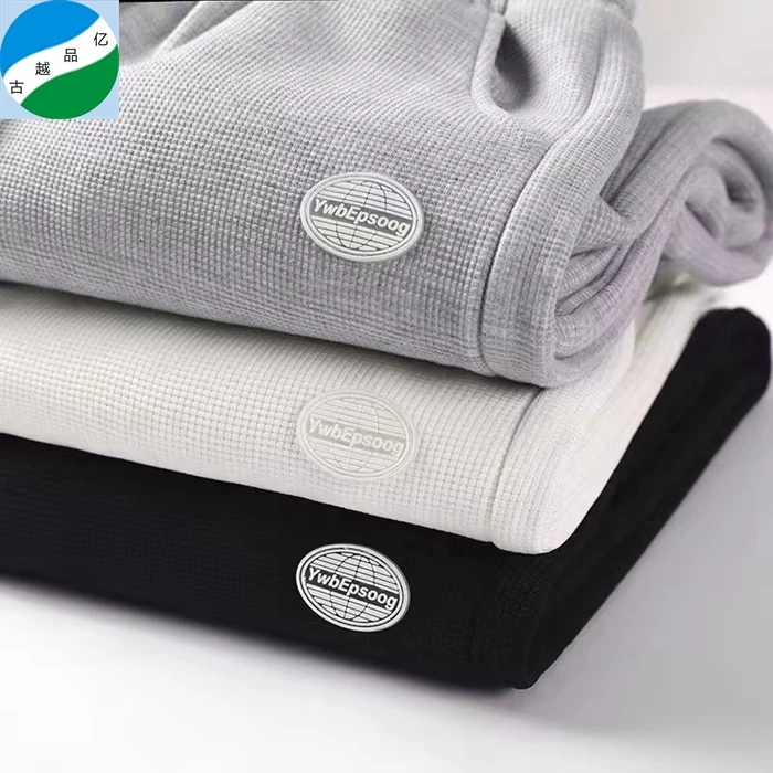 Shaoxing textile polyester cotton wholesale waffle knit fabric tshirt stock lot plain dyed for garment