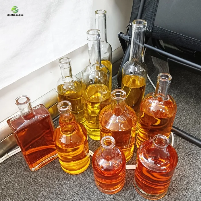 JINGNA in stock empty wine cheap 375ml 500ml 750ml round square glass bottles with lids for whisky liquor