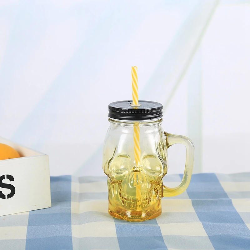 Custom Color Food Grade Skull Shape Wide Mouth Glass Mason Jar with Lids Straw Handle for Beverage Juice Container