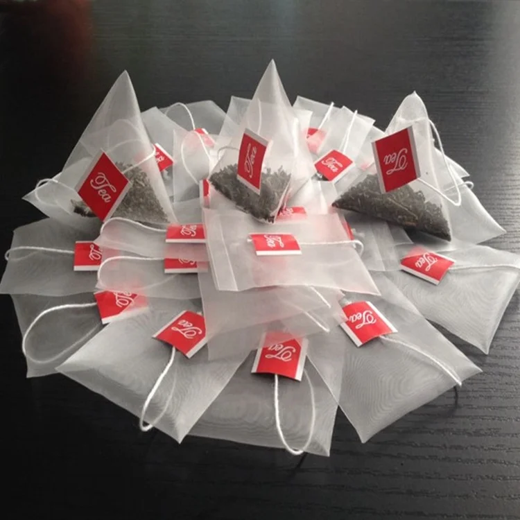 China empty nylon tea bag with string and private label  logo tag for tea packing