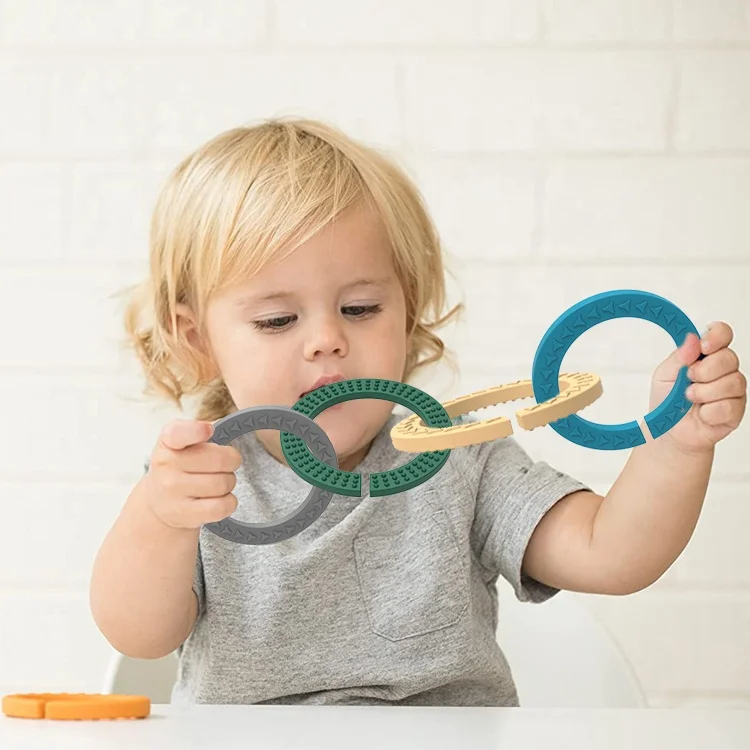 OEM/ODM mordedor de silicona Soft Food Grade Sensory Baby Teething Toys Happy Links Ring Developmental Toys Baby Teethers