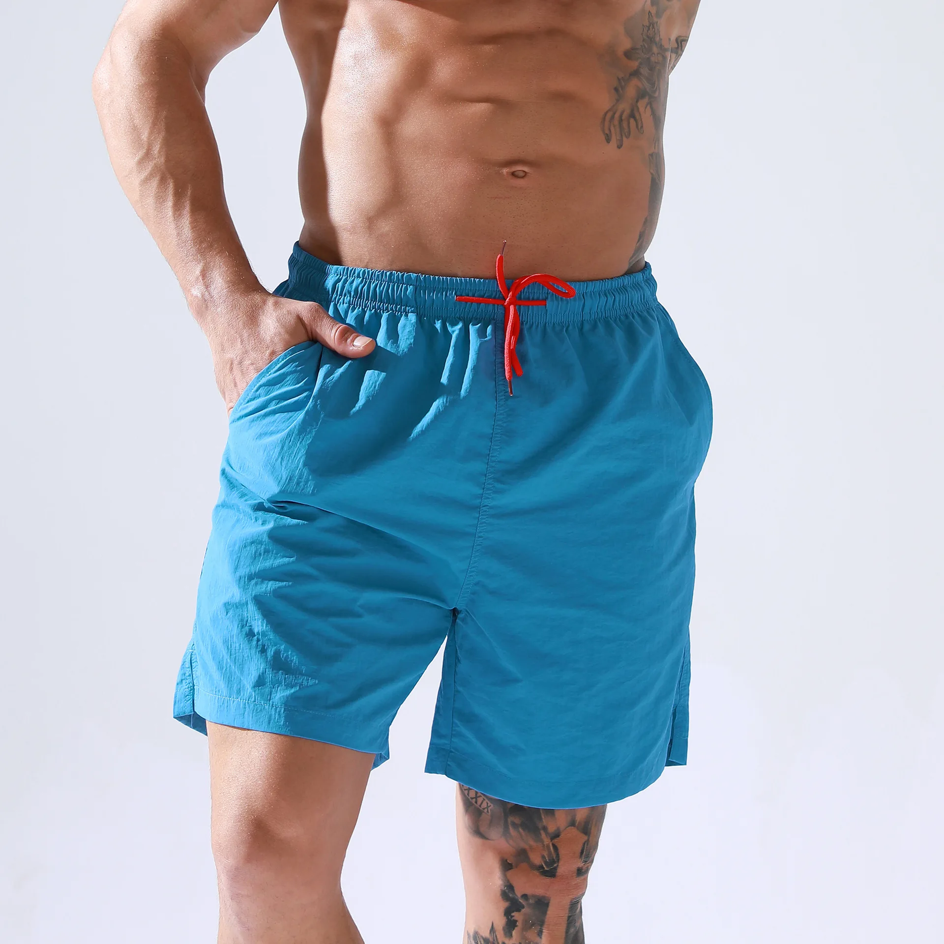 wholesale men pants summer sports shorts loose fit quick dry polyester board shorts male swim trunks beach shorts with pockets