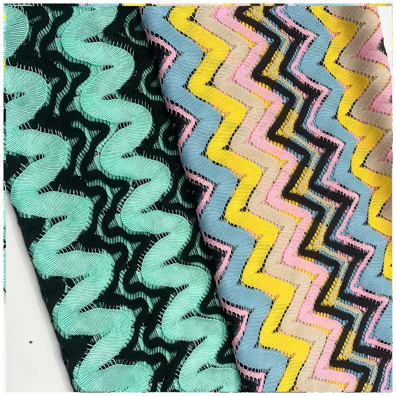 The manufacturer directly provides polyester yarn dyed blended polyester bright silk mesh knitted clothing fabric