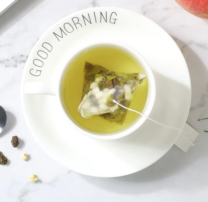 Disposable triangle nylon pyramid tea bags wholesale price tea bag with custom string