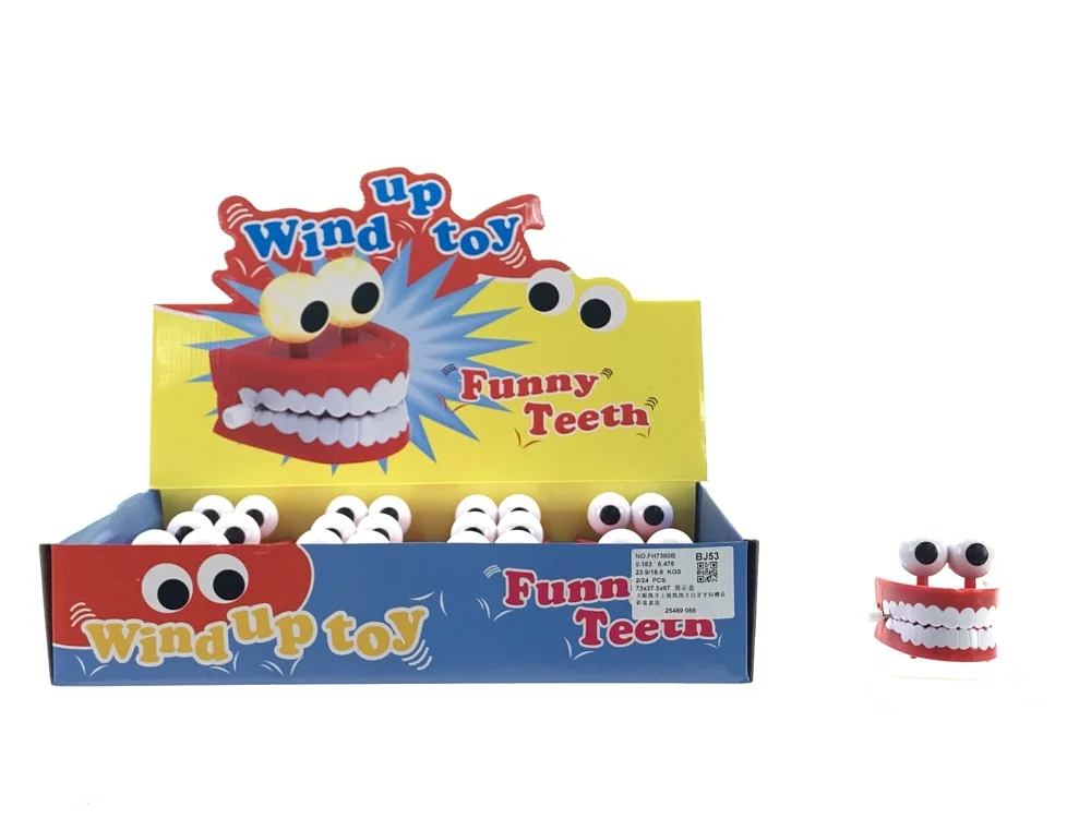 Wholesale promotional gifts plastic wind up dental teeth easter egg jumping toys