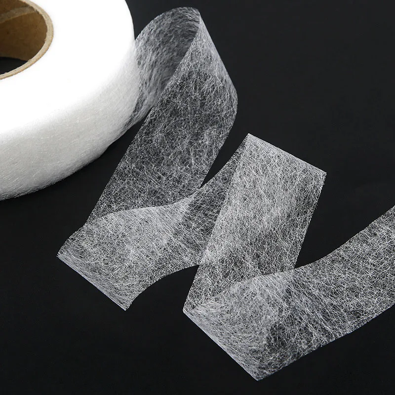 Hot melt adhesive web used for bonding fabrics together