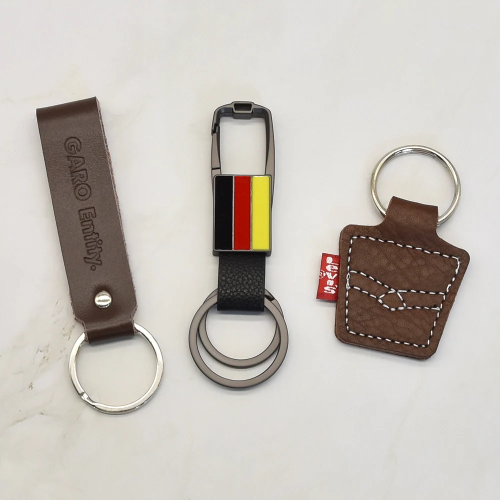 Custom embossed logo laser engraving car keychain keyring pu leather keychain metal leather keychain