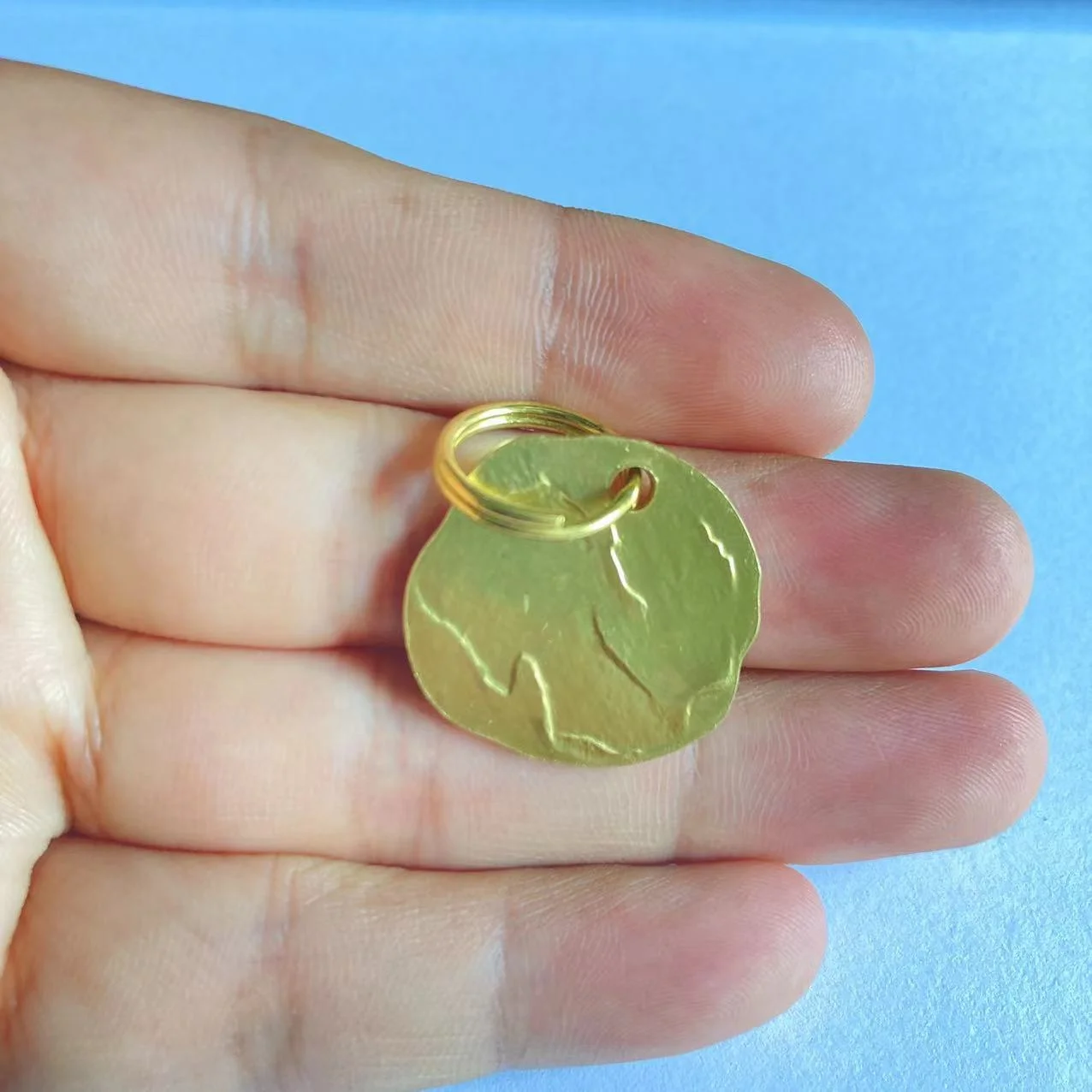 Custom logo engraved solid brass rough and not smooth round blank brass dog tags with struck effect