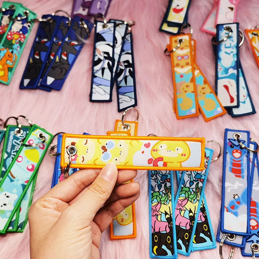 Factory Custom Wholesale Motorbike Car Anime Woven Embroidered Key Chain Tag Design Logo Fabric Embroidery Keychains