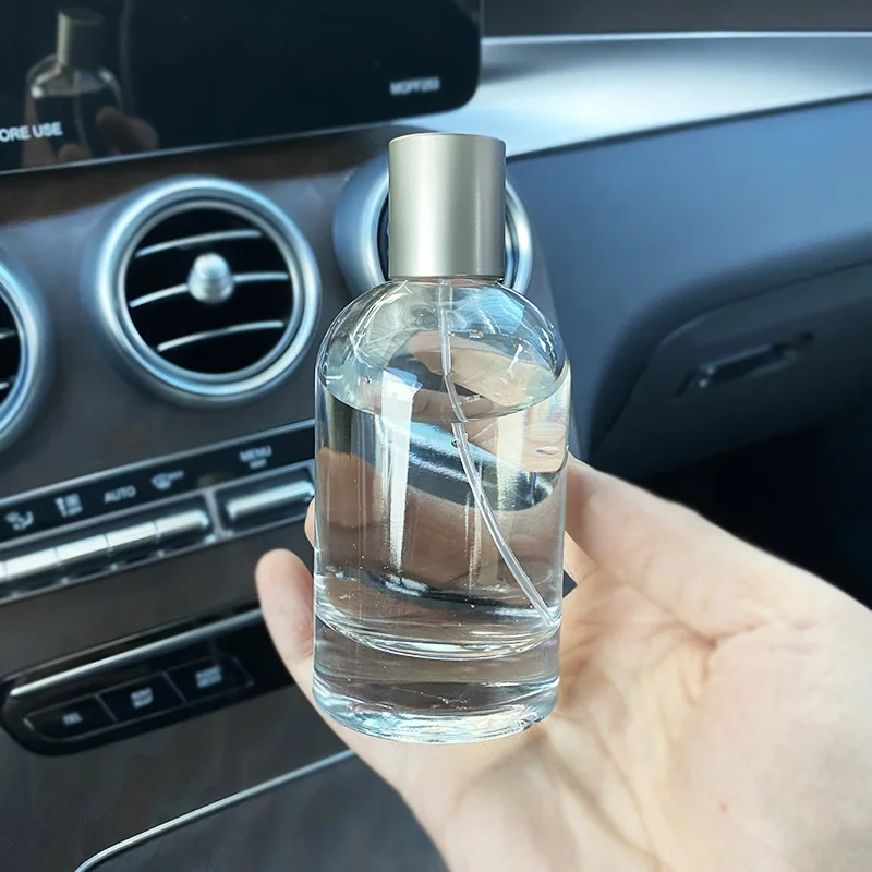 Customized round empty clear perfume glass bottle 50ml 100ml glass spray perfume bottle with metal cap