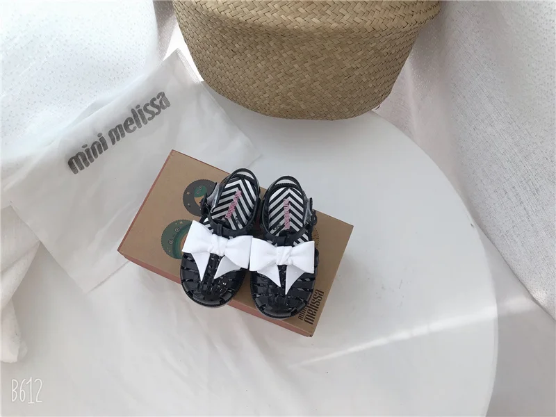 2023 mini Melissa shoes kid bowknot hollow out sandal jelly baby wrap toe soft sole beach wear resistant skid shoes