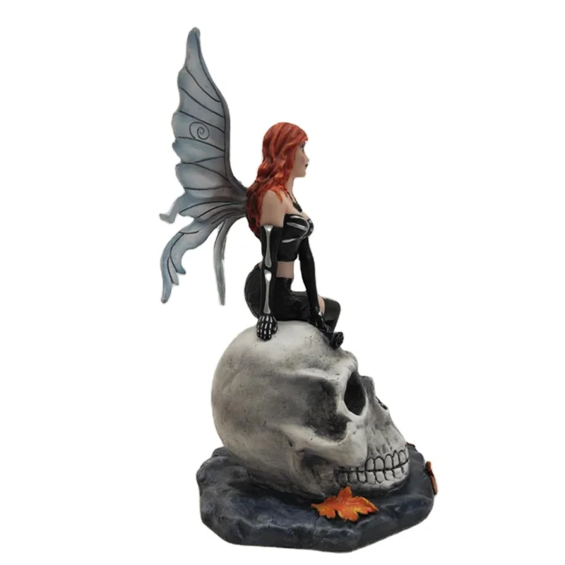 Resin butterfly girl Figurine girl sitting at skulls cartoon character figure decoration