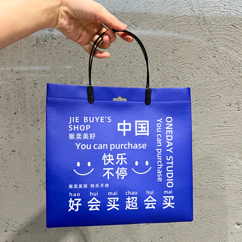 Wholesale environmentally-friendly degradable non-woven handbag free design LOGO gift shopping packaging clothes bag.