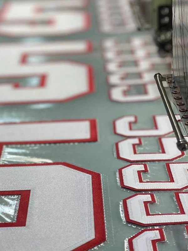 Factory Directly Sell  HotMelt Adhesive Backing  Team Colors Poly Twill  Embroidery  Applique  Tackle Twill for Sports  Jersey