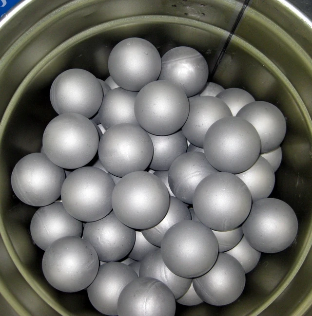 Titanium carbide balls for oil pumps