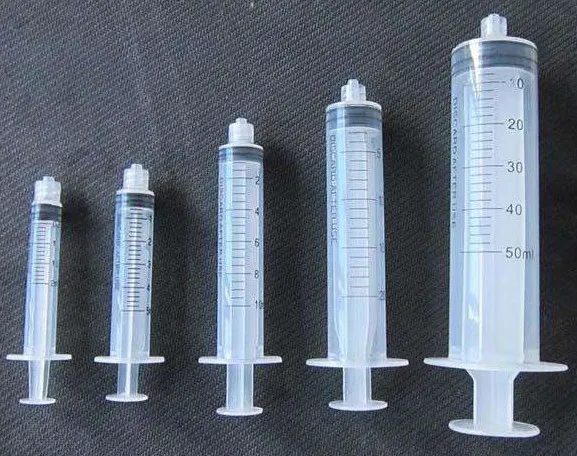 Disposable retractable safety self-destructive syringe