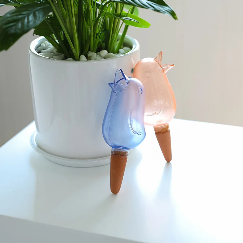 
2021 new transparent automatic dripper gardening household automatic watering bird shape lazy watering flower pot product description