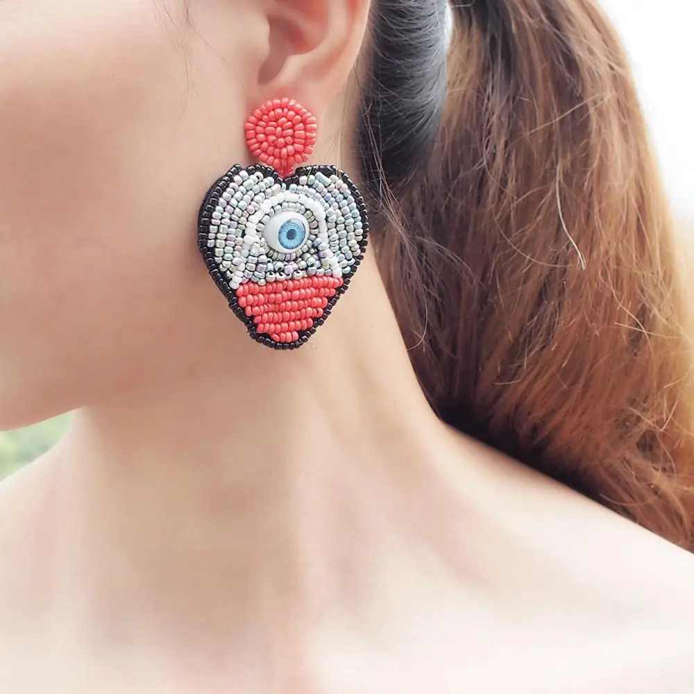 HANSIDON Trendy Statement Resin Heart Earrings Women Hot New Fashion Jewelry Devi Eye Design Drop Dangle Plastic Beaded