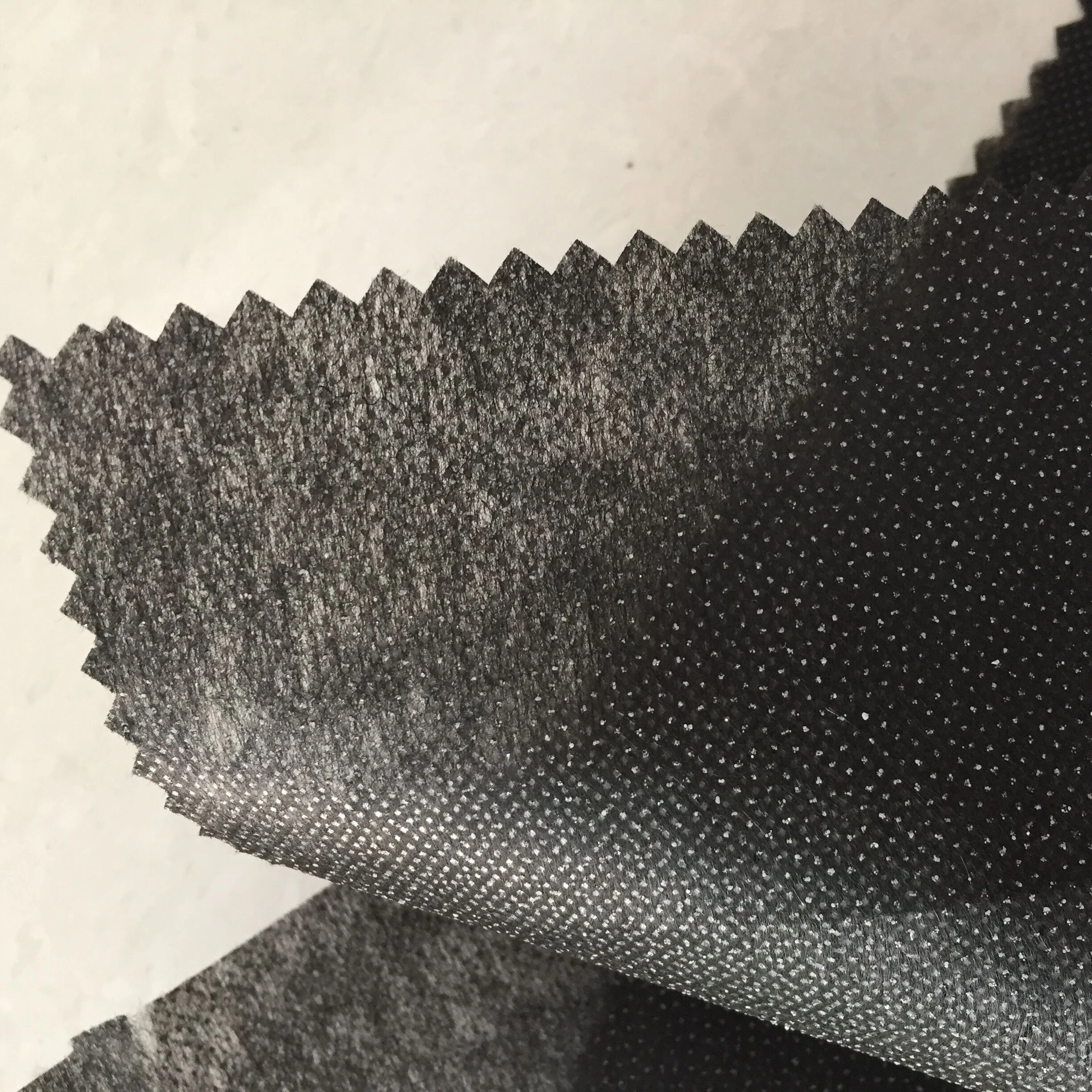 
100 Polyester reinforced stitch bond Interlining fusing brushed nonwoven buckram fabric 