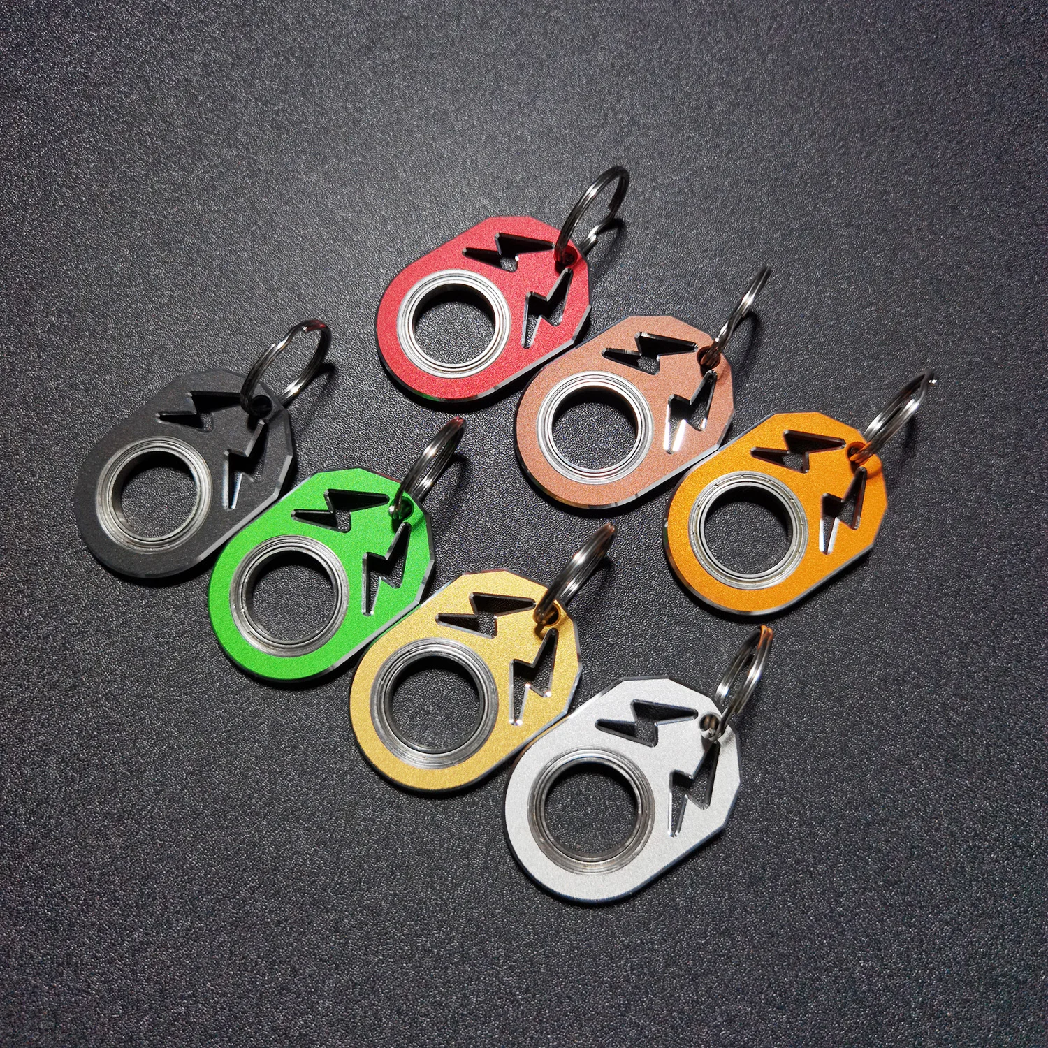 The super fun fidget keychain spinner with lightning logo matches your keys and pendant spin it anywhere anytime
