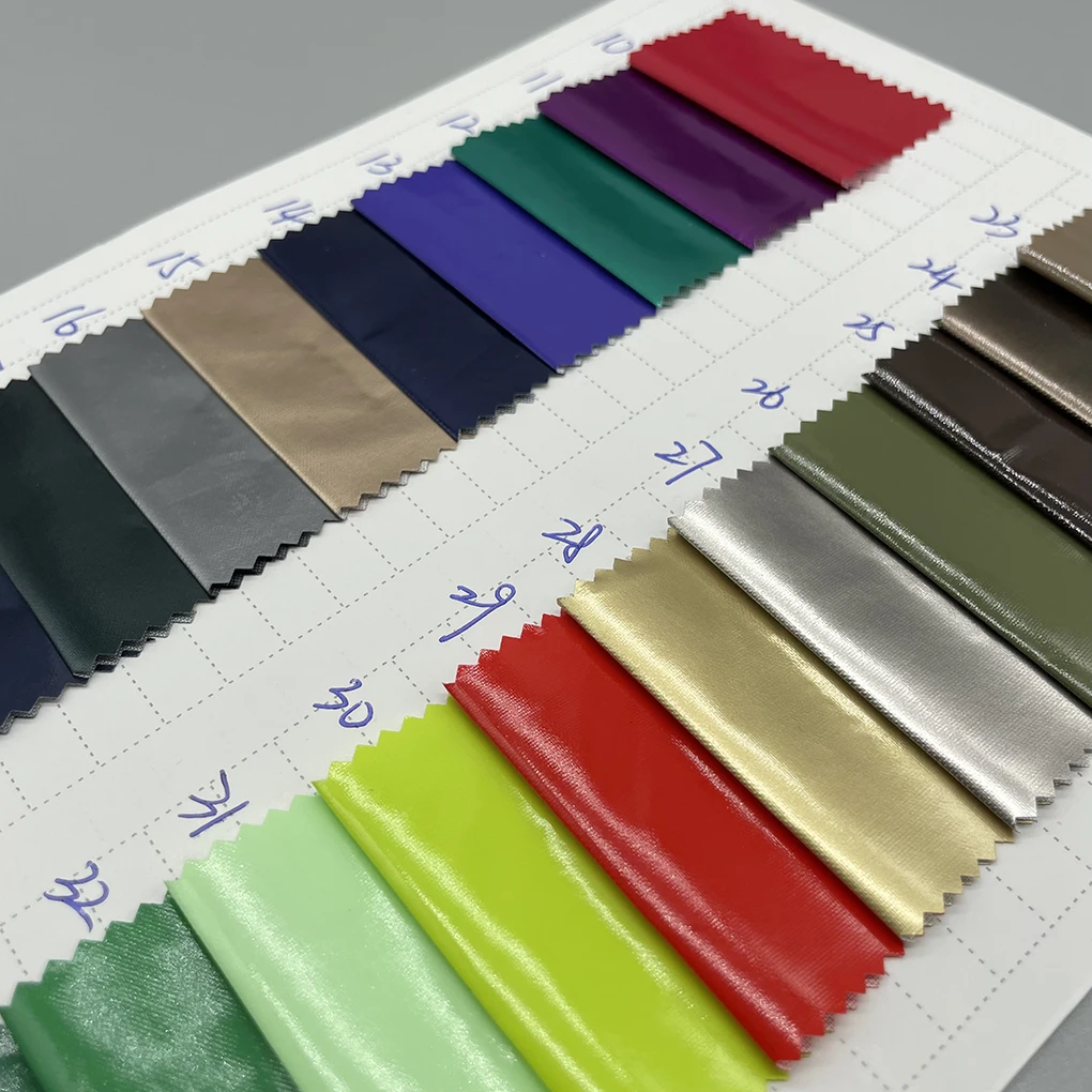 high quality in stock high light shiny PU glossy coating polyester fabric waterproof downproof material for bags jacket