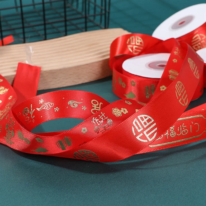 Wholesale 2.5cm Satin Red Ribbon Bow Pattern Rich Word Bronzing Home Housewarming Wedding Festive Occasions Roll Silk Ribbon
