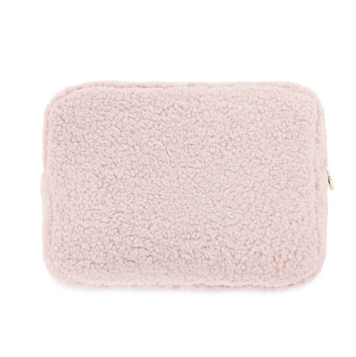 faux shearling pouch featuring a rectangle-shaped body and a zippered top handle