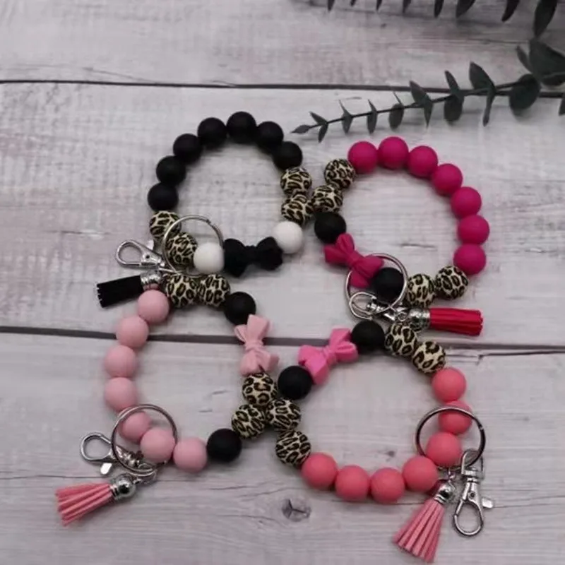 2022 Cute Girls Pink Bow Knot Leopard Silicone Beaded Bracelet Wristlet Keyring With  Leather Tassel Bracelet Key Chain