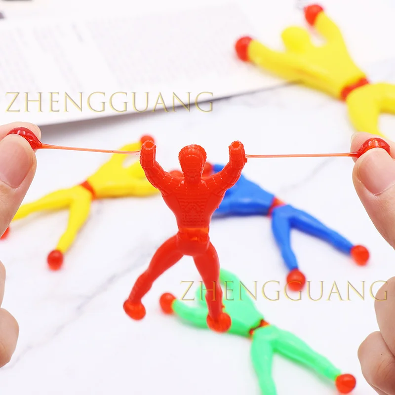 Zhengguang Wholesale Stretchy Climbing Man Window Crawlers Sticky Toys Favors Kid Play Climbing Toy Sticky Wall Climbing Toy