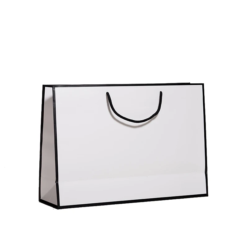 Черно-белые полосатые бумажные пакеты с ручками на заказ от производителя