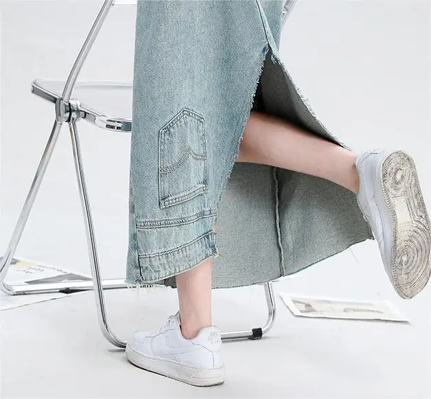 Light blue denim skirt for women with a loose split back, high waist, slim fit, and a buttocks wrapped mid length skirt