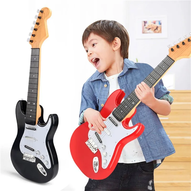 Children learn their first electronic guitar toy