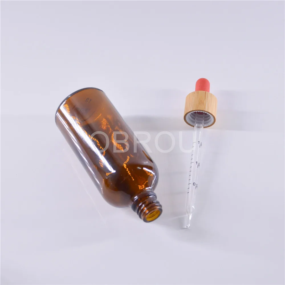 Wholesale wooden dropper cap type amber glass dropper bottles 5ml 10 ml 15ml 20ml 30ml 50ml 100 ml perfume oil bottle