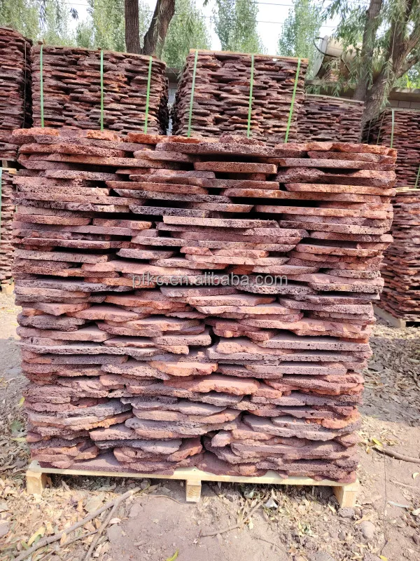 Natural red volcanic lava rock slate stone for pavement roads and wall cladding and floor patios loose lava stone slate