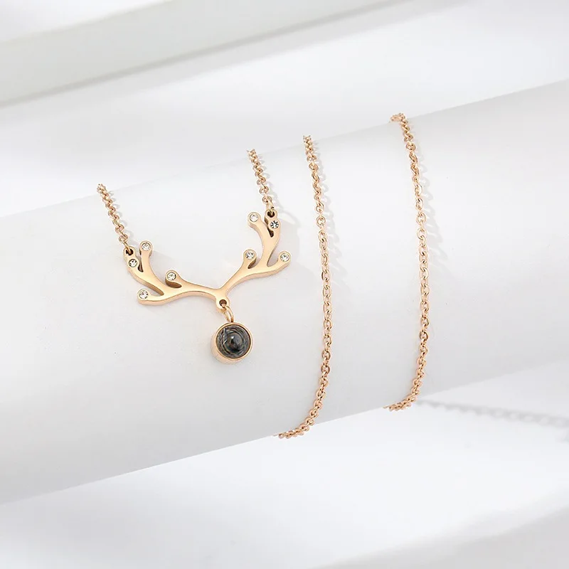 
2021 New One Deer I love You Titanium Steel Necklace Female Rose Gold Smart Deer Love Gift 100 Languages Jewelry 
