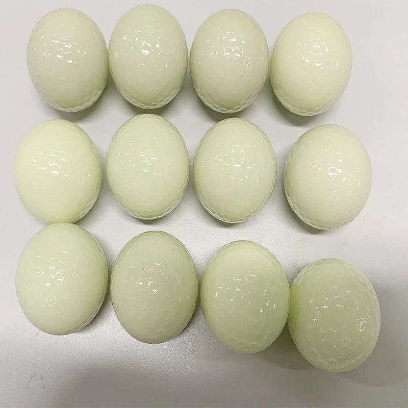 white fluorescent golf ball in golf  balls