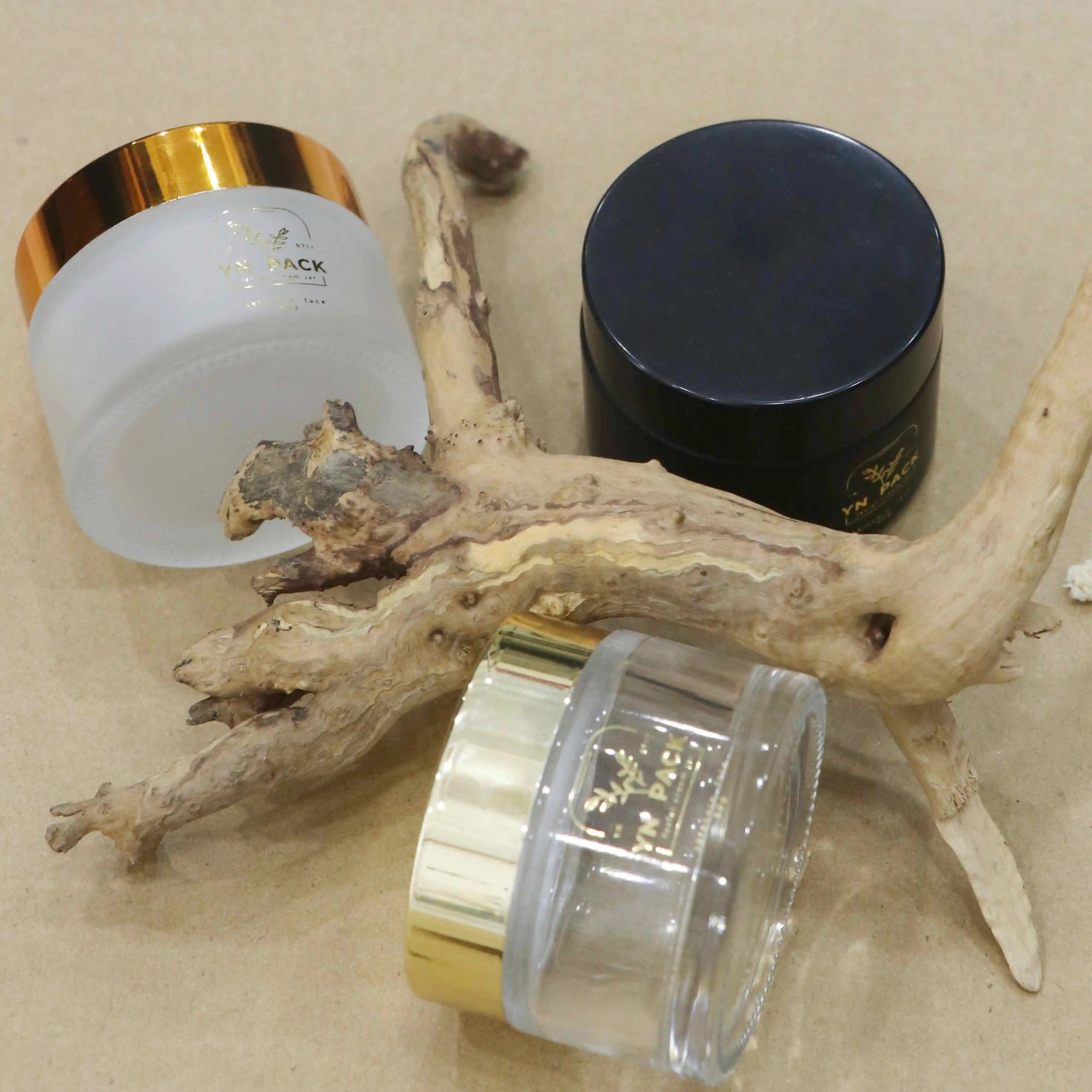 Wholesale Custom glass jars gold lids cosmetics skincare glass jar 2oz with lid