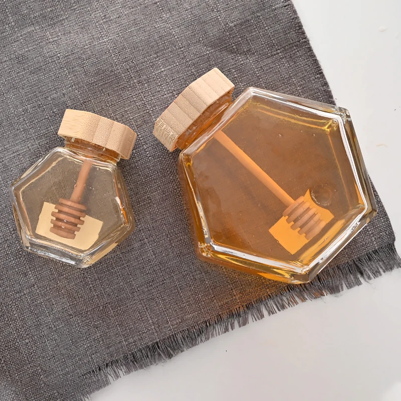 Wholesale 100ml 220ml 380ml Empty Honey bottles Clear Honeycomb hexagon bee shaped Glass Honey Jars with Lid Spoon and Dipper