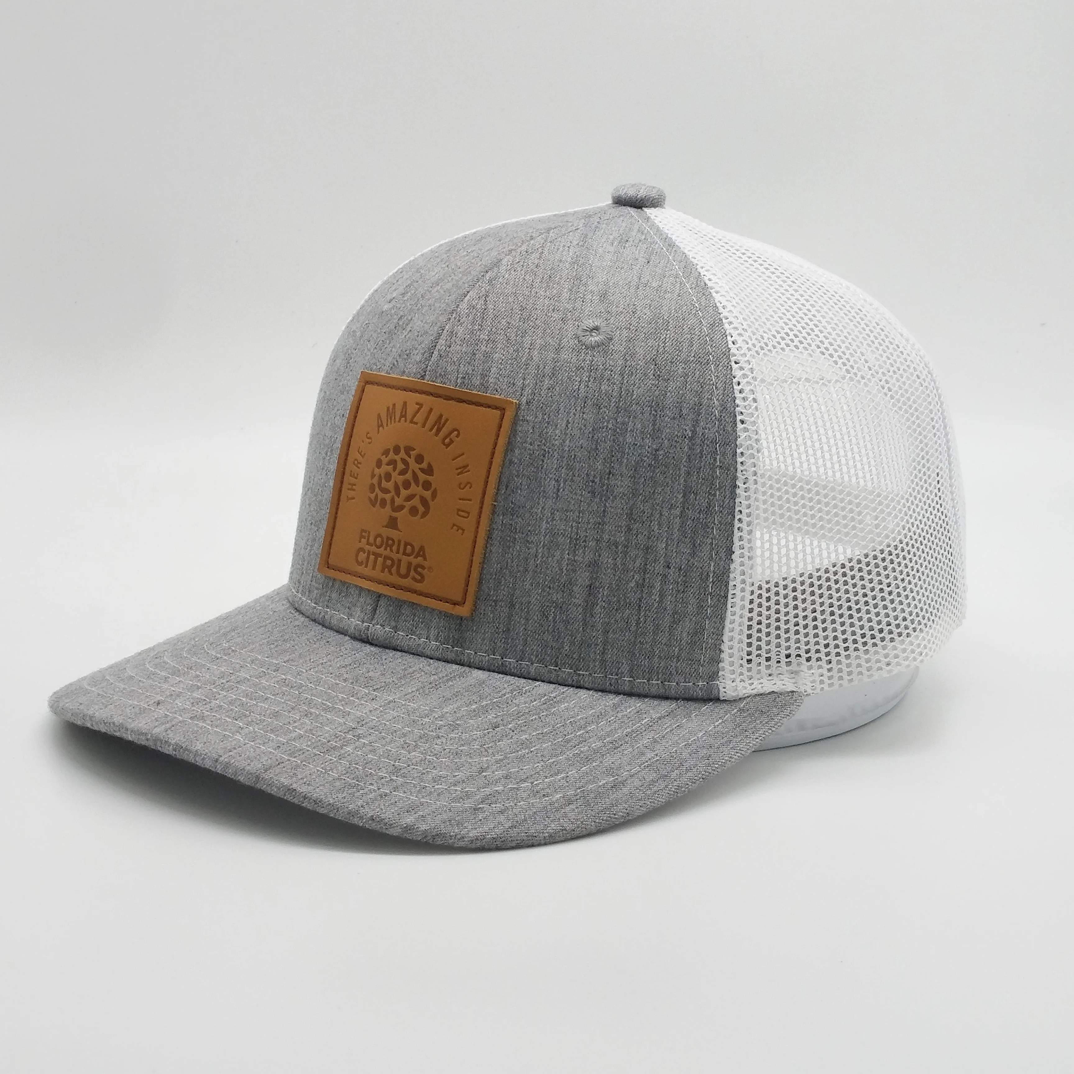 Wholesale 2019 Customized Made Rubber PVC Patch Laser Boring Holes Trucker Cap Mesh Hat