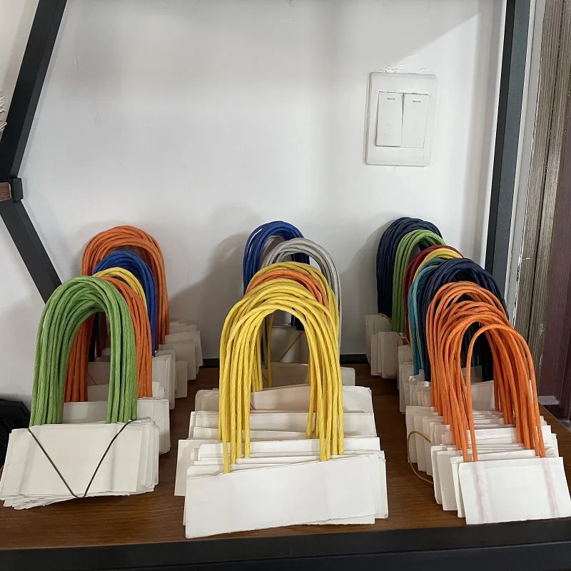 Customized cowhide shopping bag handle with white twisted rope for paper bags