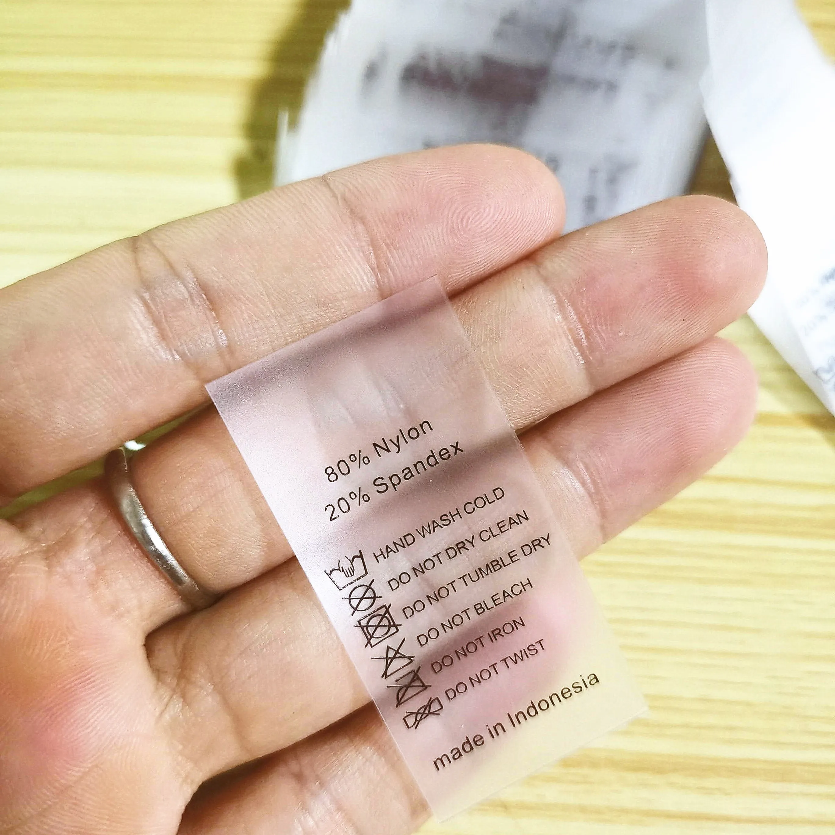 
Garment underwear size custom printed clear TPU sewn tag with logo and care symbol 