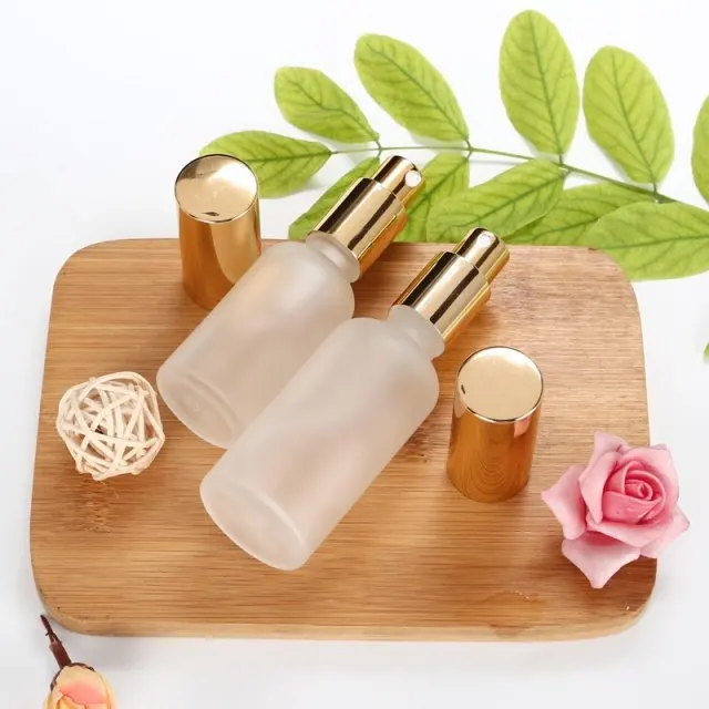 wholesale empty frosted glass lotion bottle for skin care 10ml 20ml 30ml 50ml cosmetic pump glass spray bottle manufacturers