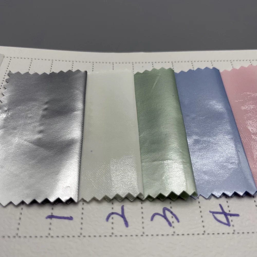 high quality in stock high light shiny PU glossy coating polyester fabric waterproof downproof material for bags jacket