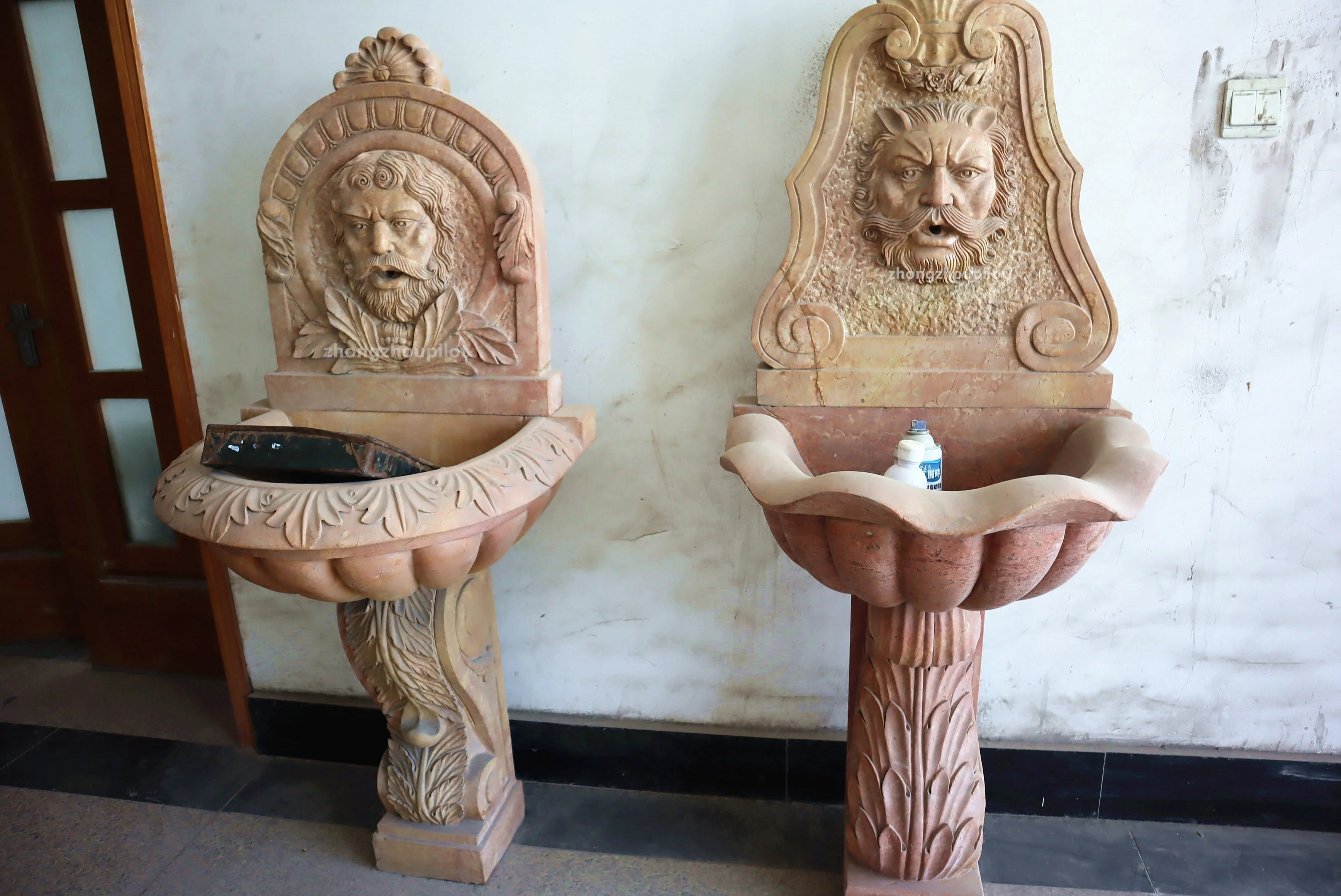 Indoor and outdoor red and beige stone small waterfall wall man head water fountain