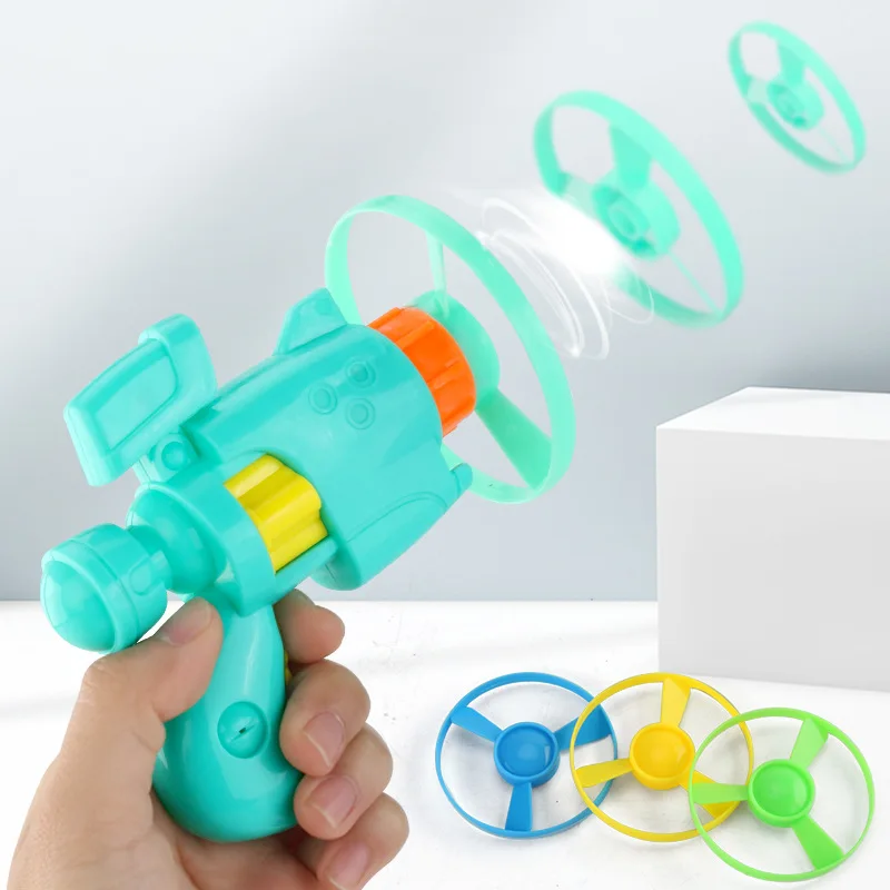 HY Toys dragonfly flying saucer light pistol Flying Fairy outdoor ejection spinning cross border toys for childre