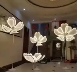 The wedding party is decorated with large flowers and lanterns