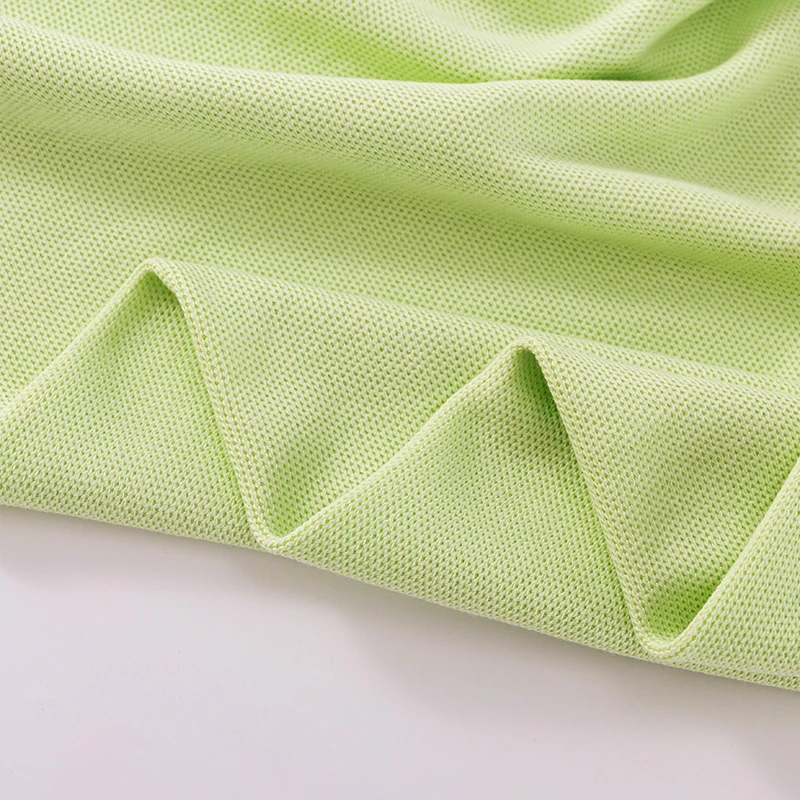 Best Selling Polo Shirt Fabric 290 GSM 55% Cotton 45% Polyester CVC Knitted Fishnet Pique Fabric for Polo T-shirt