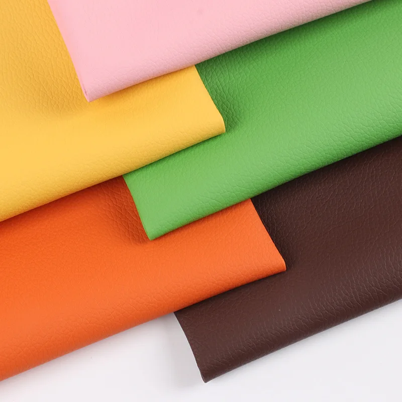 Wholesale 0.55mm lychee pattern nonwoven fabric substrate faux leather designer fabric PVC leather for car mats seat cushions